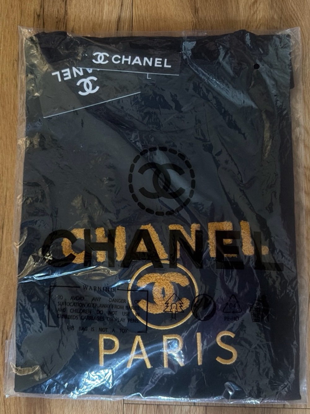 CHANEL Black Short Sleeve Tee with Gold Logo